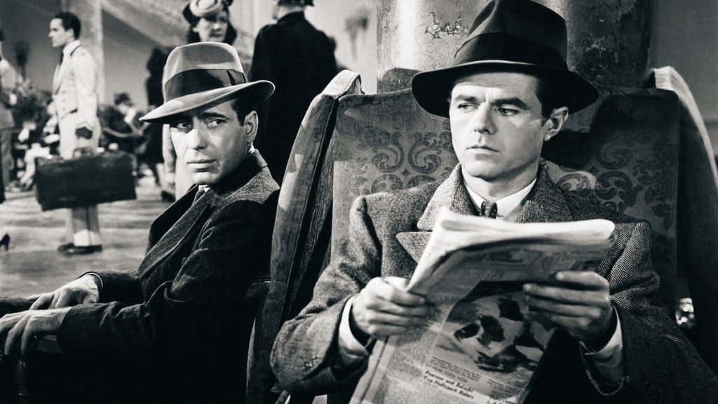 Humphrey Bogart and Elisha Cook Jr. in a hotel lobby scene from The Maltese Falcon